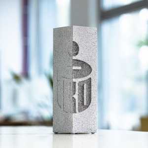 Glass award with concrete style finish